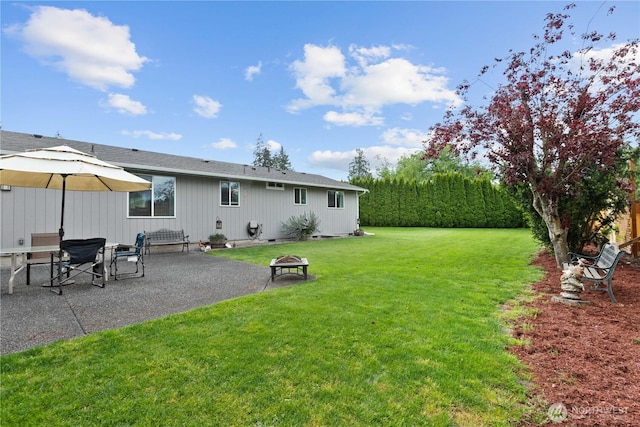 2313 N 19th Pl, Mount Vernon, WA 98273 - view of grassy yard featuring an outdoor fire pit and a patio