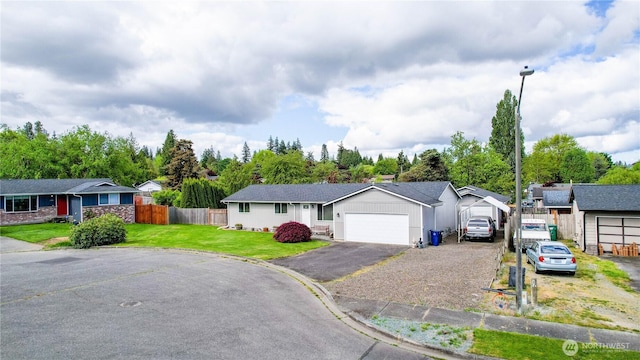 2313 N 19th Pl, Mount Vernon, WA 98273 - single story home with an attached garage, a residential view, and asphalt driveway