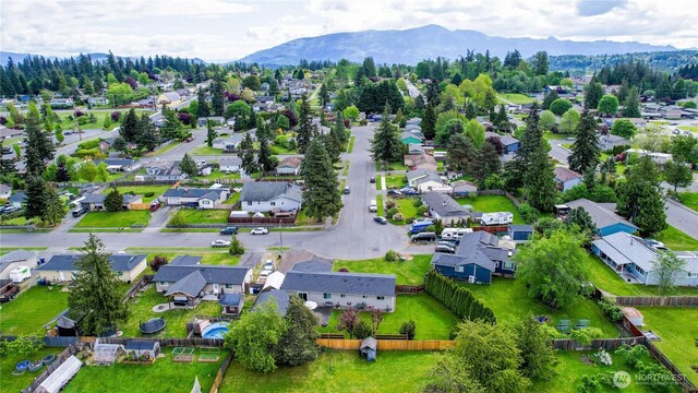 2313 N 19th Pl, Mount Vernon, WA 98273 - aerial overview of property's location with nearby suburban area and mountains