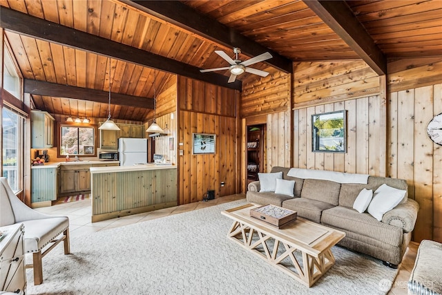 8310 E State Route 106, Union, WA 98592 - living area with plenty of natural light, ceiling fan, light tile patterned floors, wood walls, and wood ceiling