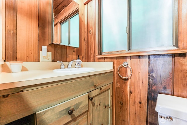 8310 E State Route 106, Union, WA 98592 - bathroom featuring toilet, vanity, and wooden walls