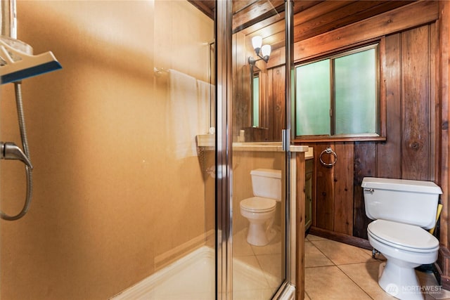 8310 E State Route 106, Union, WA 98592 - bathroom with toilet, a shower stall, tile patterned flooring, and wood walls