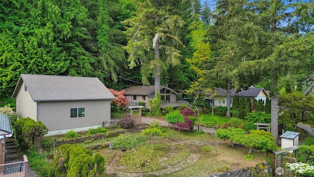 8310 E State Route 106, Union, WA 98592 - view of yard featuring a vegetable garden and an outbuilding