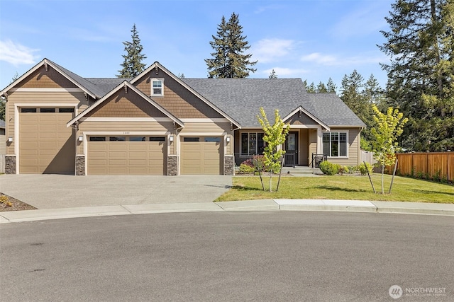1803 135th Street Ct S, Tacoma, WA 98444 - craftsman-style house featuring a garage, stone siding, and concrete driveway