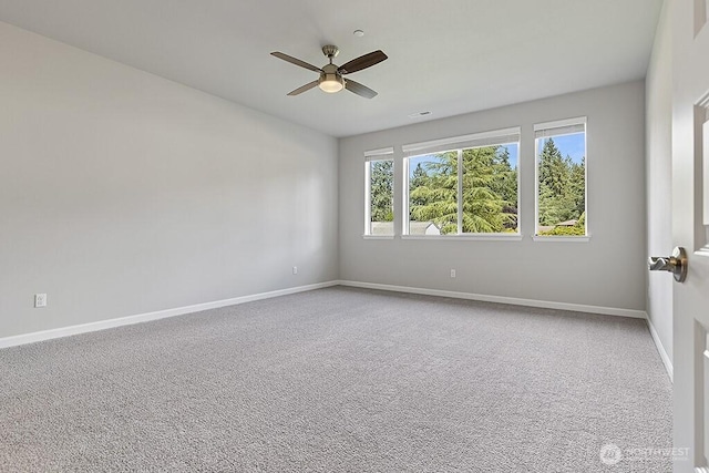 1803 135th Street Ct S, Tacoma, WA 98444 - carpeted spare room with a ceiling fan and baseboards