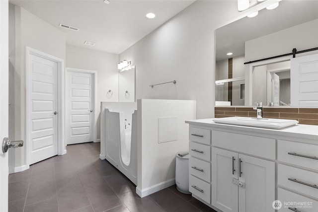 1803 135th Street Ct S, Tacoma, WA 98444 - full bath with baseboards, tile patterned floors, recessed lighting, vanity, and a shower