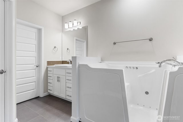 1803 135th Street Ct S, Tacoma, WA 98444 - bathroom featuring tile patterned flooring, a jetted tub, and vanity