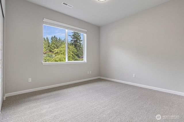 1803 135th Street Ct S, Tacoma, WA 98444 - carpeted spare room with baseboards