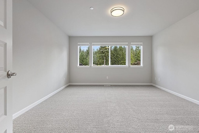 1803 135th Street Ct S, Tacoma, WA 98444 - carpeted spare room with baseboards
