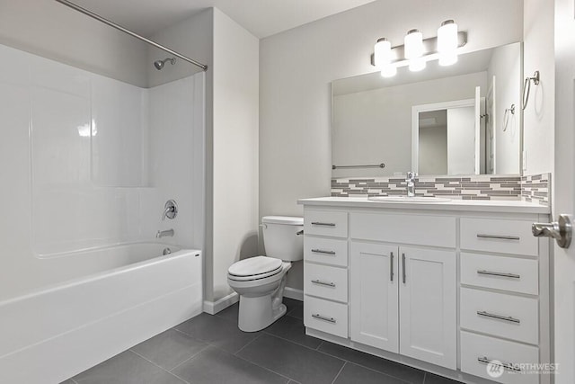 1803 135th Street Ct S, Tacoma, WA 98444 - bathroom with toilet, decorative backsplash, washtub / shower combination, tile patterned flooring, and vanity