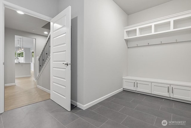 1803 135th Street Ct S, Tacoma, WA 98444 - mudroom with dark tile patterned flooring, baseboards, recessed lighting, and a sink