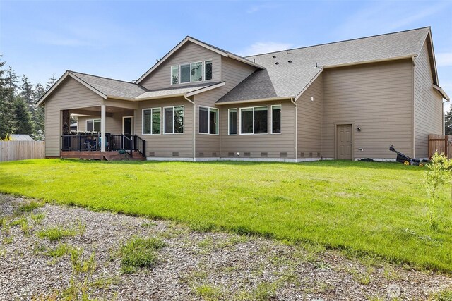 1803 135th Street Ct S, Tacoma, WA 98444 - back of property with crawl space, roof with shingles, and a wooden deck