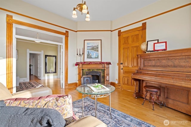 1005 15th St, Bellingham, WA 98225 - living room featuring wood finished floors, a fireplace, and baseboards