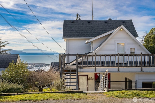 1005 15th St, Bellingham, WA 98225 - rear view of property with roof with shingles, a deck with mountain view, and stairway