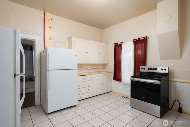 766 120th St S Unit A & B, Tacoma, WA 98444 - kitchen with freestanding refrigerator, stainless steel electric range oven, and white cabinets