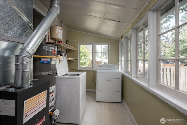 766 120th St S Unit A & B, Tacoma, WA 98444 - laundry area with washing machine and dryer, baseboards, water heater, and light wood-style floors