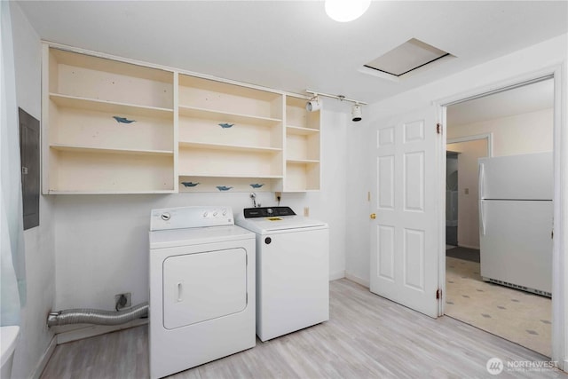 766 120th St S Unit A & B, Tacoma, WA 98444 - washroom featuring separate washer and dryer, light wood-style floors, and baseboards