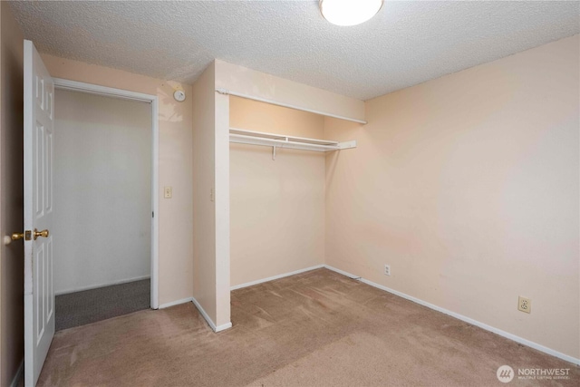 766 120th St S Unit A & B, Tacoma, WA 98444 - unfurnished bedroom with carpet flooring, a textured ceiling, a closet, and baseboards