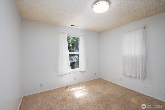 766 120th St S Unit A & B, Tacoma, WA 98444 - carpeted spare room featuring a textured ceiling and baseboards