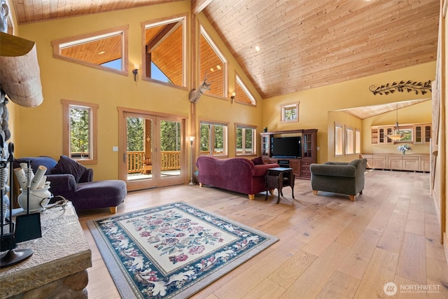2677 Sumac Ln, Leavenworth, WA 98826 - living area with high vaulted ceiling, light wood finished floors, wooden ceiling, and french doors