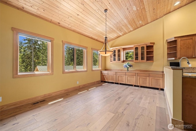 2677 Sumac Ln, Leavenworth, WA 98826 - unfurnished dining area featuring light wood finished floors, vaulted ceiling, and wood ceiling