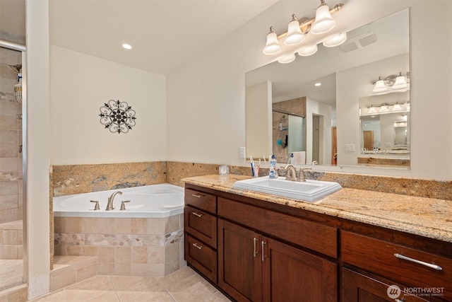 2677 Sumac Ln, Leavenworth, WA 98826 - bathroom featuring a stall shower, tile patterned floors, a bath, and vanity