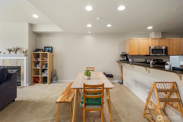 1000 Cabin Creek Ln SW Unit C204, Issaquah, WA 98027 - kitchen featuring stainless steel microwave, stove, light colored carpet, recessed lighting, and dark countertops