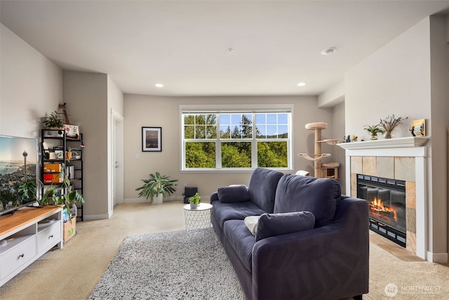 1000 Cabin Creek Ln SW Unit C204, Issaquah, WA 98027 - living area featuring light colored carpet, a tiled fireplace, recessed lighting, and baseboards