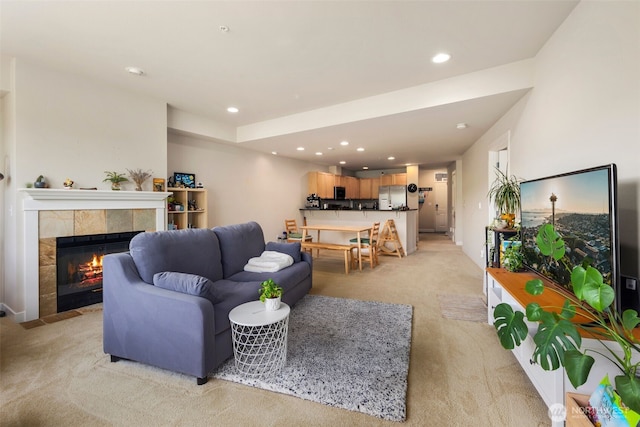 1000 Cabin Creek Ln SW Unit C204, Issaquah, WA 98027 - living room featuring light colored carpet, recessed lighting, and a tile fireplace