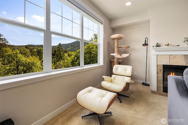 1000 Cabin Creek Ln SW Unit C204, Issaquah, WA 98027 - living area with plenty of natural light, carpet, baseboards, a tiled fireplace, and recessed lighting