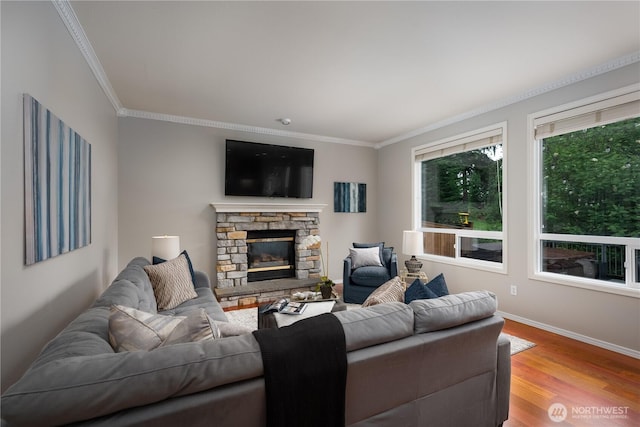 9702 S 230th Pl, Kent, WA 98031 - living room with crown molding, baseboards, wood finished floors, and a fireplace