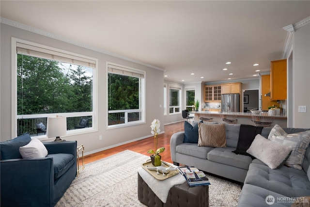 9702 S 230th Pl, Kent, WA 98031 - living room with recessed lighting, ornamental molding, light wood finished floors, and baseboards