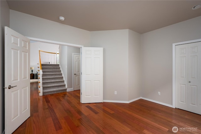 9702 S 230th Pl, Kent, WA 98031 - unfurnished bedroom featuring dark wood-type flooring and baseboards