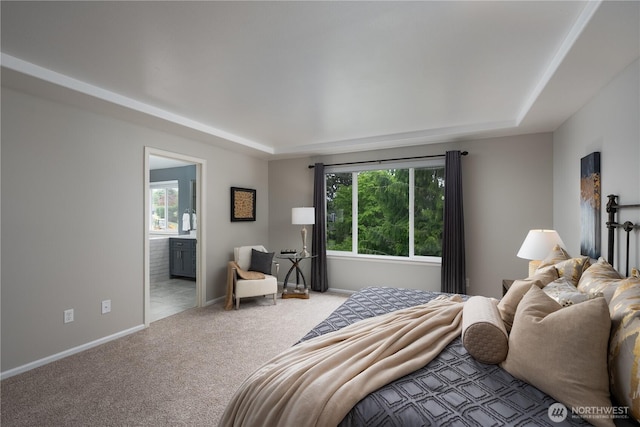 9702 S 230th Pl, Kent, WA 98031 - carpeted bedroom featuring multiple windows, baseboards, and ensuite bath