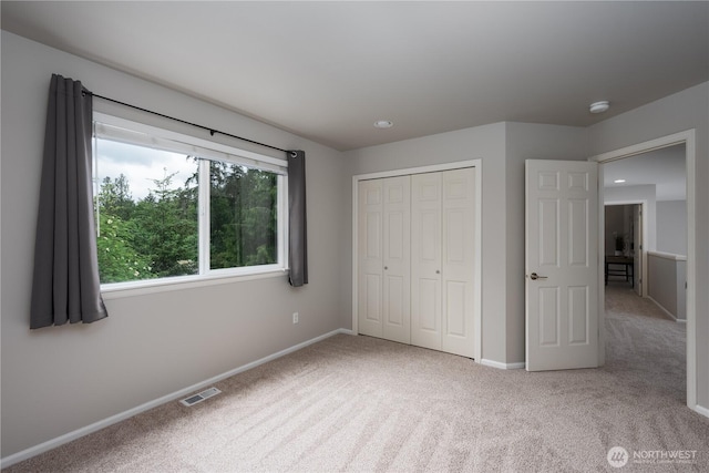 9702 S 230th Pl, Kent, WA 98031 - unfurnished bedroom featuring carpet, baseboards, and a closet