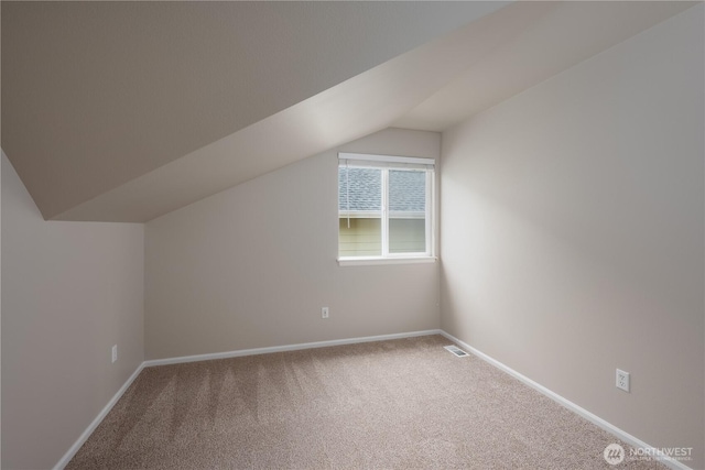 9702 S 230th Pl, Kent, WA 98031 - additional living space with carpet, vaulted ceiling, and baseboards