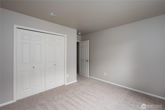 9702 S 230th Pl, Kent, WA 98031 - unfurnished bedroom featuring carpet, a closet, and baseboards