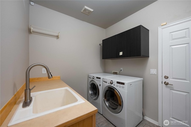 9702 S 230th Pl, Kent, WA 98031 - laundry room featuring cabinet space, washer and clothes dryer, and light tile patterned flooring
