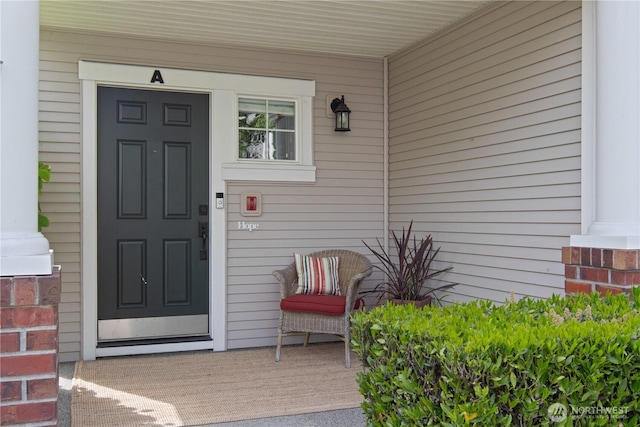 entrance to property featuring a porch
