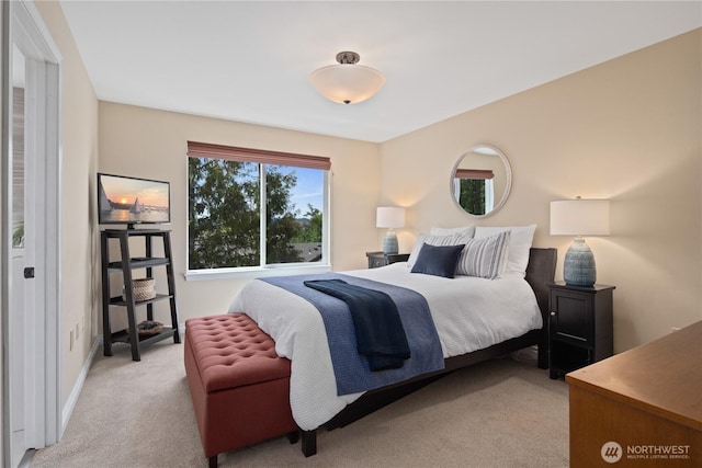 carpeted bedroom with baseboards