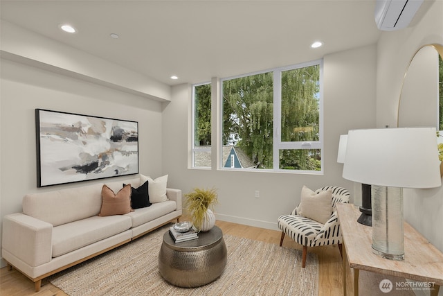 1106B 34th Ave, Seattle, WA 98122 - living area with a wall mounted AC, light wood-style flooring, recessed lighting, and baseboards