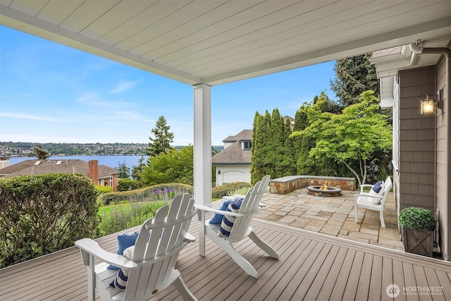 7934 Lake View Ln, Mercer Island, WA 98040 - wooden deck featuring a fire pit, a patio, and a water view