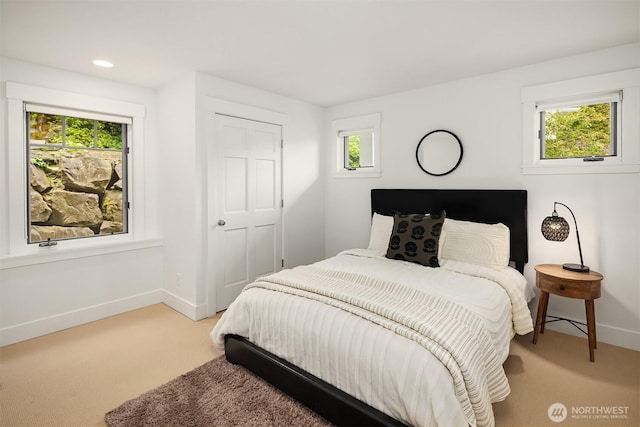 7934 Lake View Ln, Mercer Island, WA 98040 - bedroom featuring light colored carpet, baseboards, multiple windows, and recessed lighting