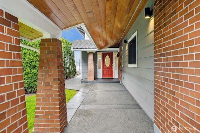 entrance to property with brick siding