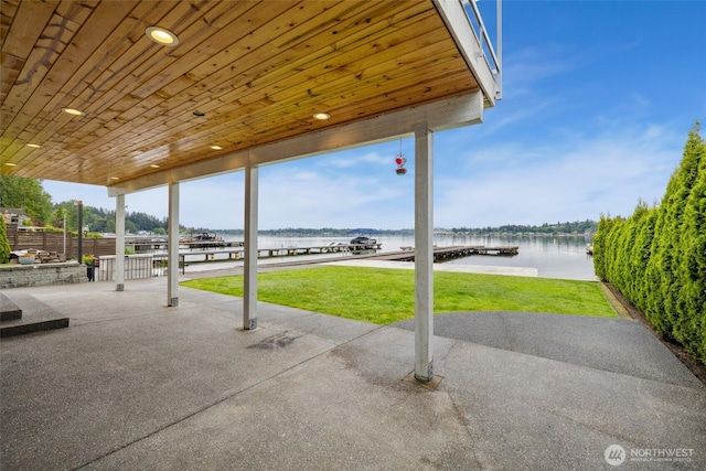 view of patio with a water view
