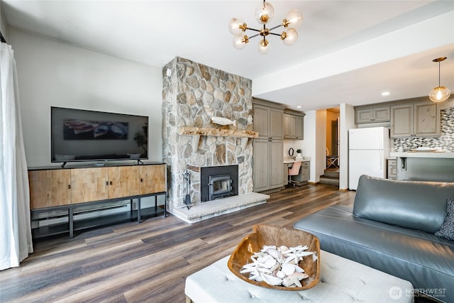 living room featuring dark wood-style floors and a chandelier
