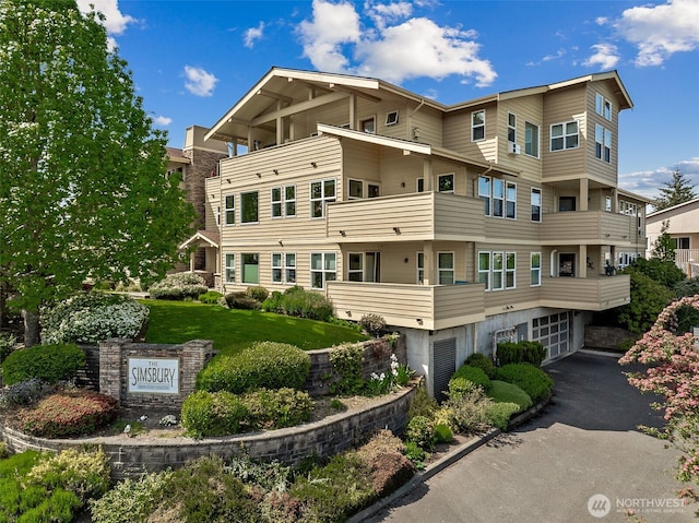430 SW 156th St Unit 204, Burien, WA 98166 - view of building exterior featuring a garage and driveway