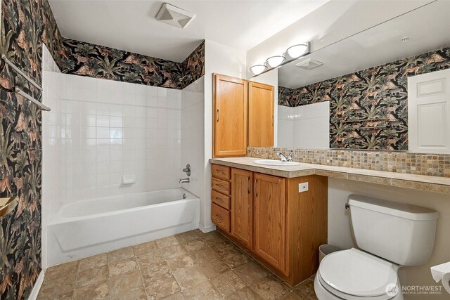 430 SW 156th St Unit 204, Burien, WA 98166 - bathroom with toilet, vanity, tub / shower combination, and stone finish floors