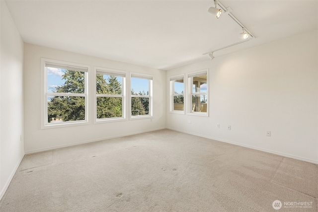 430 SW 156th St Unit 204, Burien, WA 98166 - carpeted empty room with track lighting and baseboards