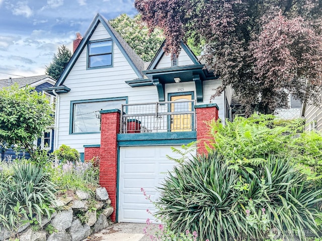 1915 Dexter Ave N, Seattle, WA 98109 - view of front of house with a balcony, a chimney, and an attached garage